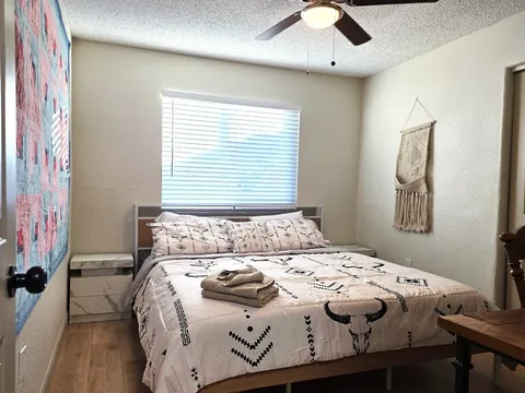 Guest bedroom with southwestern bedding at a rental property we manage in Chandler, Arizona