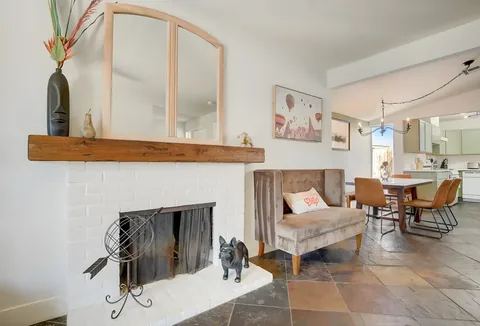 Living and dining area with fireplace and natural light at a rental property we manage in Las Vegas, Nevada