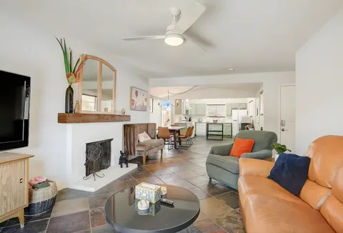 Living room opening onto the kitchen in an open-plan rental home at a rental property we manage in Las Vegas, Nevada